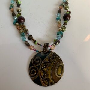 Unbranded bead and metal necklace. Beads seed beads. 2 inch pendant magnet clasp